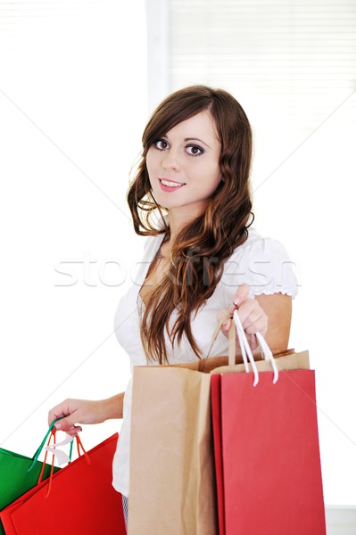 Beautiful girl holding many shopping bags and smiling Stock photo © zurijeta