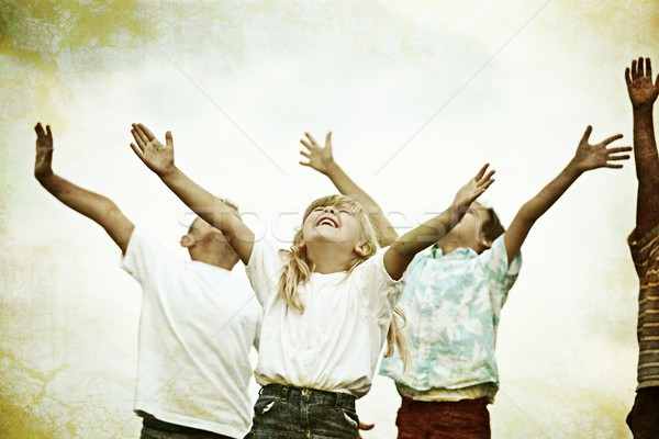 Retro image of a happy children on summer grass meadow in nature Stock photo © zurijeta