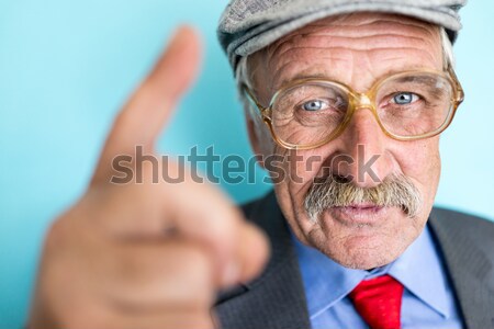 Portrait of a smiling and confident mature businessman with must Stock photo © zurijeta