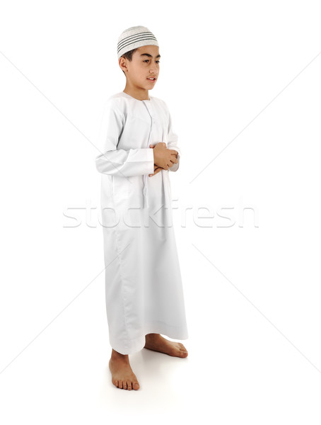 Stock photo: Islamic pray explanation full serie. Arabic child showing complete Muslim movements while praying, s