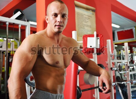 Athletic bodybuilder, execute exercise in sport gym hall Stock photo © zurijeta