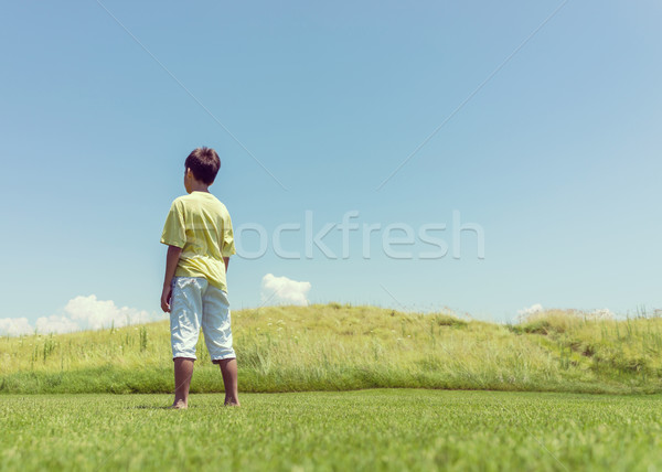 Boy with open hands in beautiful nature Stock photo © zurijeta