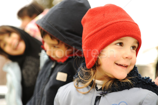 Happy group of children outdoor, winter clothes Stock photo © zurijeta