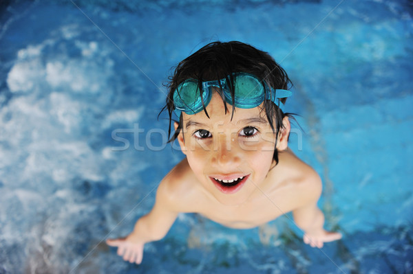 Little cute boy at pool Stock photo © zurijeta