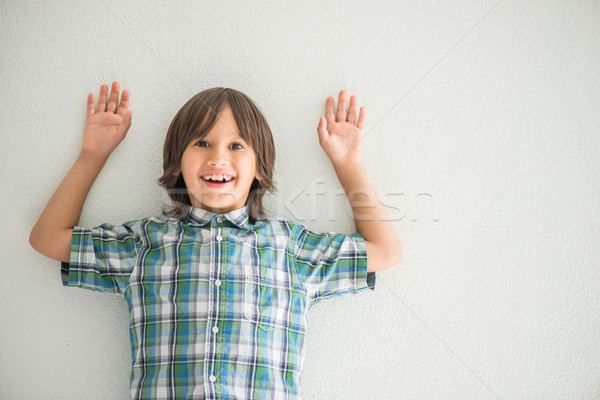Boy with his hands up Stock photo © zurijeta