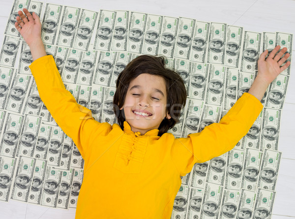 Dollars and boy Stock photo © zurijeta