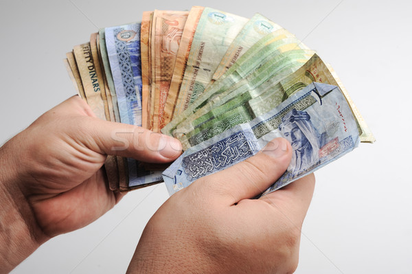 Counting arabic money in hands Stock photo © zurijeta