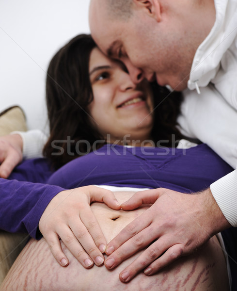 Hearth shape on pregnant's belly, couple in love  Stock photo © zurijeta