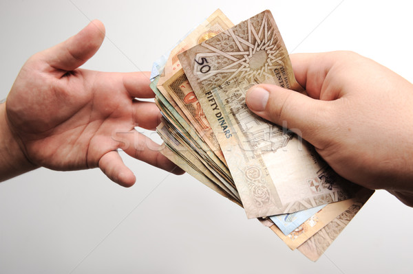 Giving money Stock photo © zurijeta