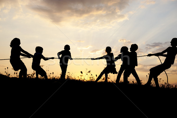 [[stock_photo]]: Silhouette · groupe · heureux · enfants · jouer · prairie