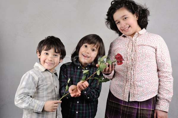 Beautiful kids with red rose Stock photo © zurijeta