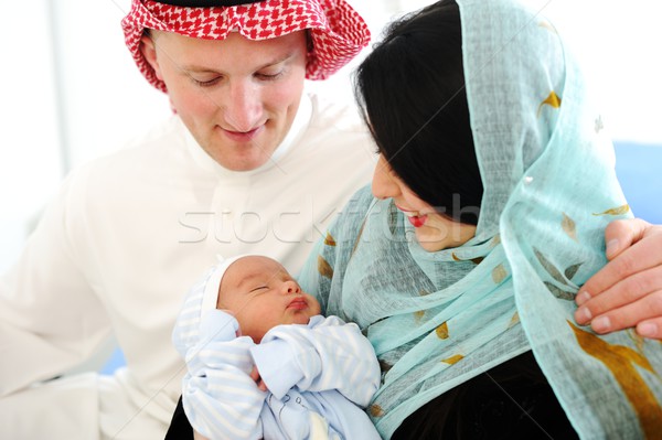 Arabic Muslim couple with new baby at home Stock photo © zurijeta