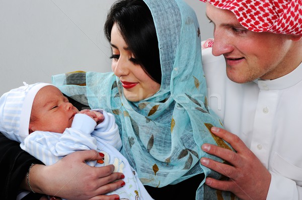 Arabic Muslim couple with new baby at home Stock photo © zurijeta