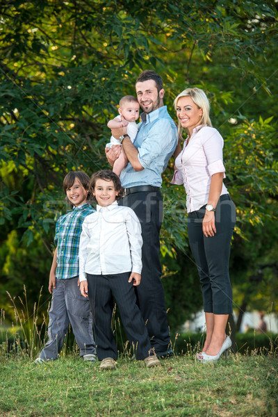 Couple posing with three kids Stock photo © zurijeta