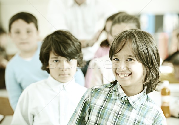 Active real children at classroom having school lesson Stock photo © zurijeta