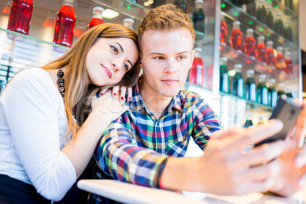 Authentic image of young real romantic couple having good time t Stock photo © zurijeta