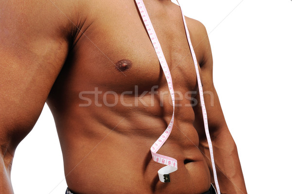 Muscular man is being measured Stock photo © zurijeta