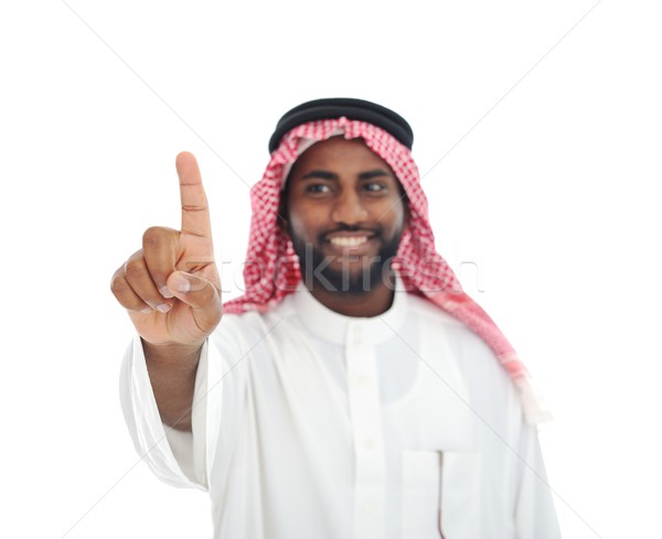 Arabian African man with finger on screen - ready for your messa Stock photo © zurijeta