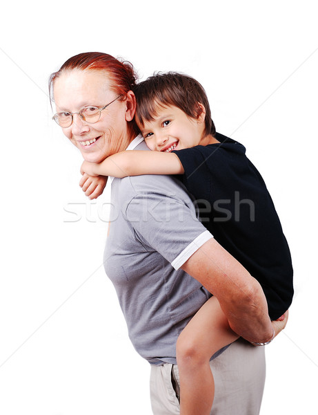 Middle aged woman holding little boy on her back Stock photo © zurijeta
