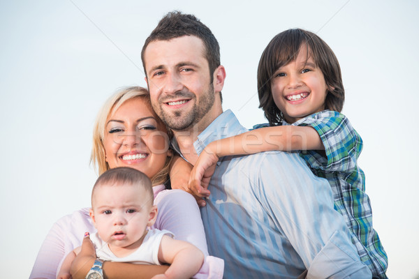 Happy family hugging Stock photo © zurijeta