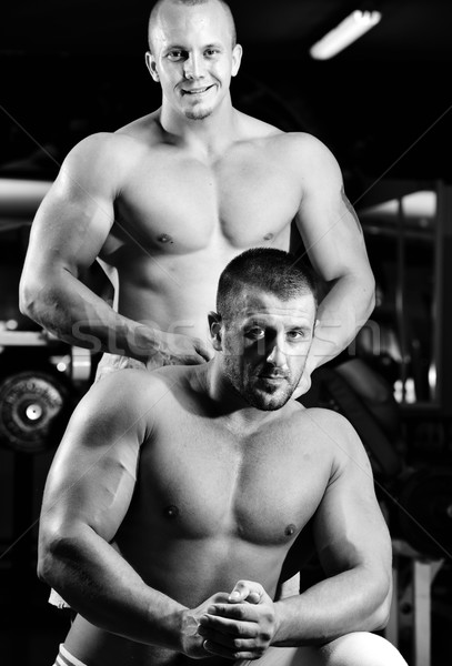Athletic bodybuilder, execute exercise in sport gym hall Stock photo © zurijeta