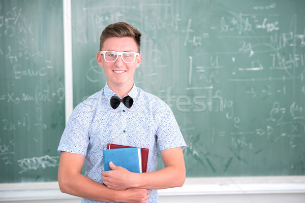 Teenager halten Lehrbücher Gläser Schule Hintergrund Stock foto © zurijeta