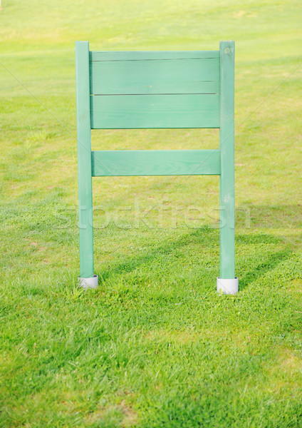 Wooden board for your message on green grass field Stock photo © zurijeta