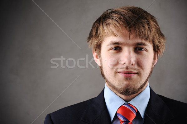 Handsome young man in a suit and west Stock photo © zurijeta
