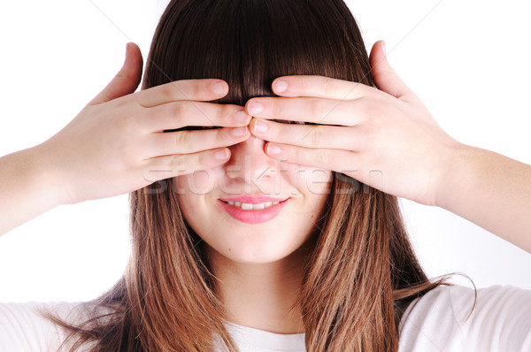 Young teen woman covering her eyes isolated on white background Stock photo © zurijeta