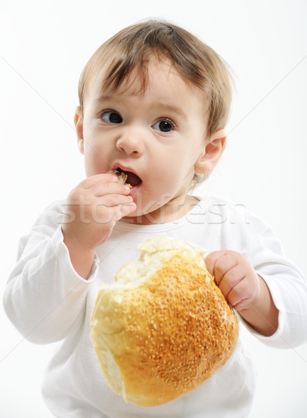 Baby eating bun bread Stock photo © zurijeta
