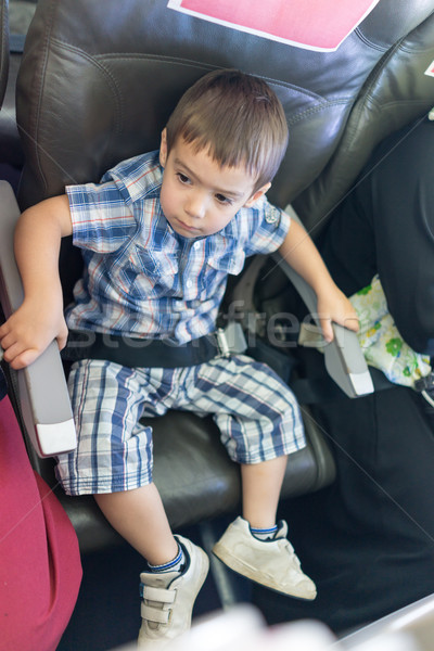 Kid traveling by airplane Stock photo © zurijeta