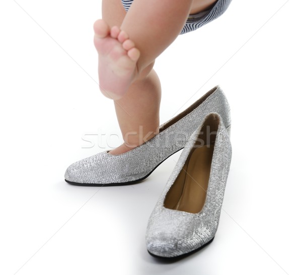 Little child playing whit mommy silver shoes Stock photo © zurijeta