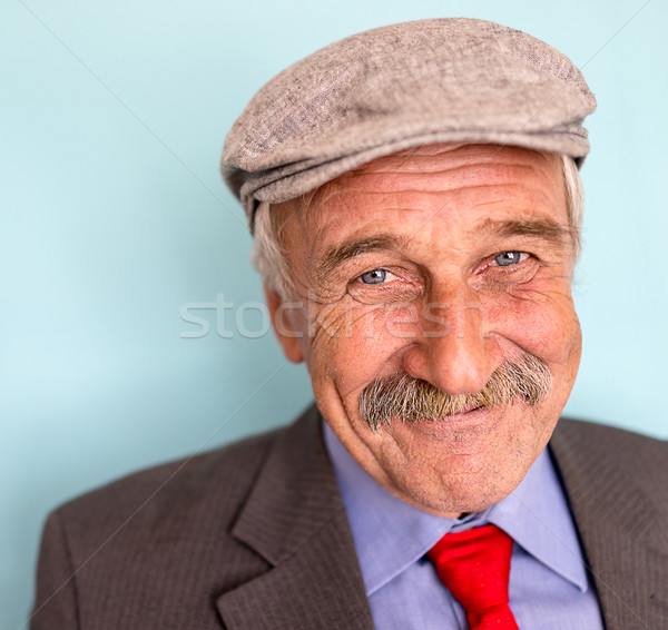 Portrait of a smiling and confident mature businessman with must Stock photo © zurijeta