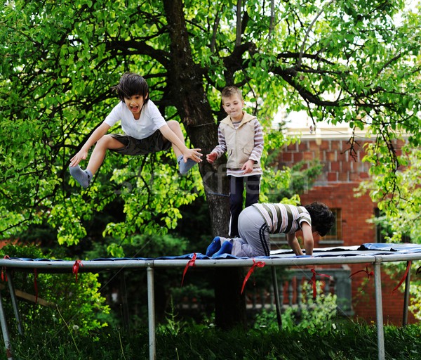 Glücklich Kinder genießen Kindheit Trampolin heiter Stock foto © zurijeta