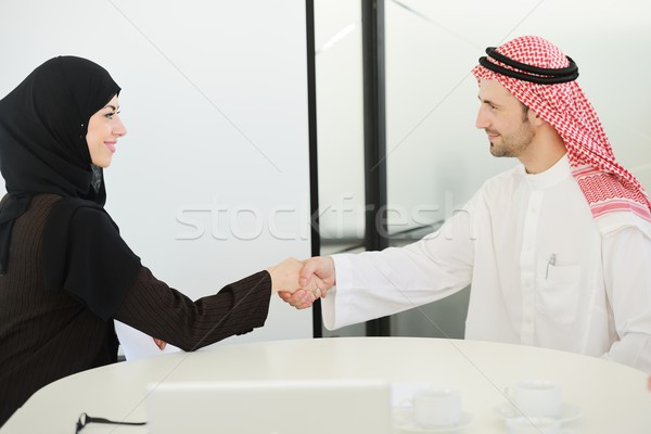 Group of multi ethnic business people dealing a contract and hand shaking Stock photo © zurijeta