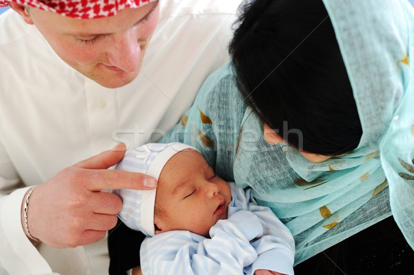 Arabic Muslim couple with new baby at home Stock photo © zurijeta