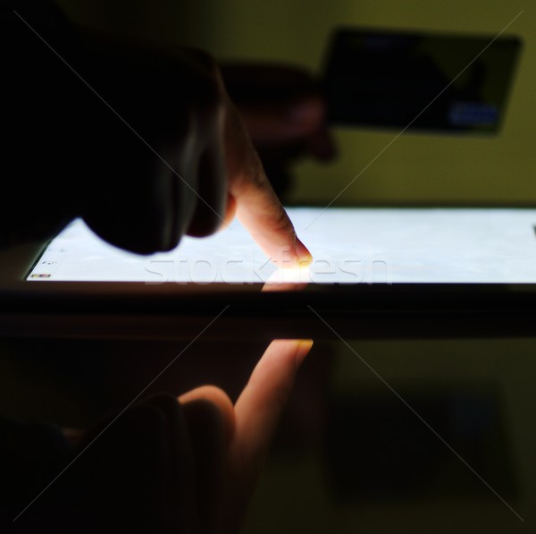 Human hand on tablet pc and credit card for shopping online Stock photo © zurijeta