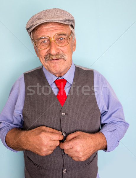 Portrait of a smiling and confident mature businessman with must Stock photo © zurijeta