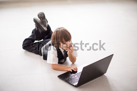 Business kid wearing suit with laptop Stock photo © zurijeta