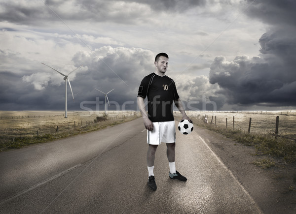 a football player standing on the road Stock photo © zurijeta