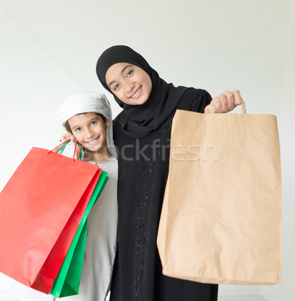 Happy Arabic family having fun time with shopping bags Stock photo © zurijeta
