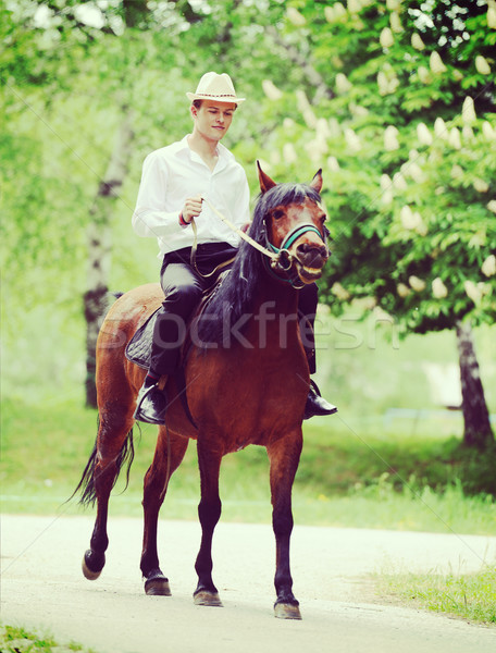 Happy young people on countryside with horse for riding Stock photo © zurijeta