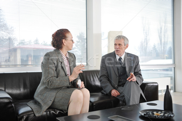 Two colleagues having a break during business meeting with cigarette Stock photo © zurijeta