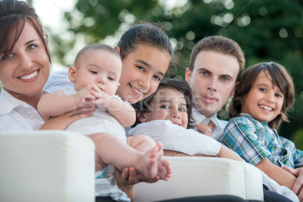 Happy family on armchairs Stock photo © zurijeta