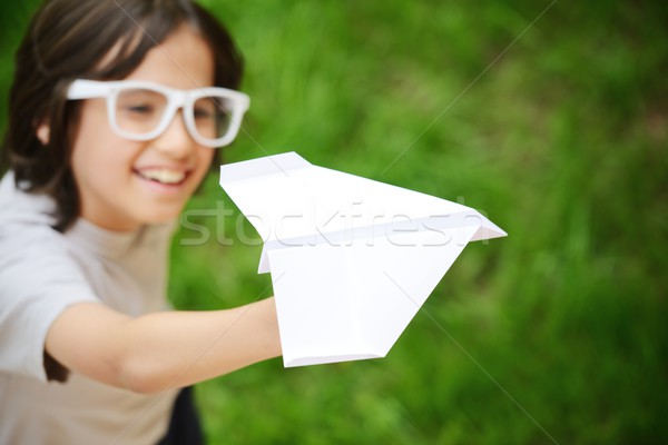 Kid Flying бумажный самолетик мальчика Сток-фото © zurijeta