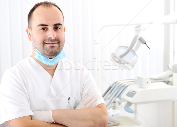 Dentis at his dental office Stock photo © zurijeta