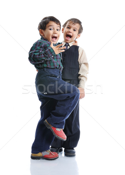 Happy children with fashionable clothes isolated Stock photo © zurijeta