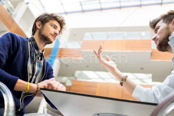 Image of young partners discussing brainstorming and ideas at me Stock photo © zurijeta