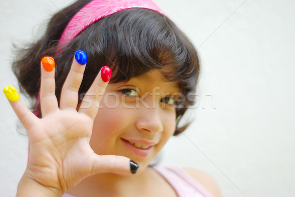 Girl with color on her fingers Stock photo © zurijeta