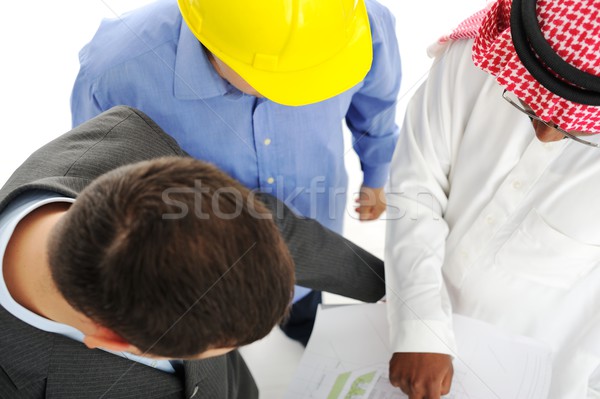 Stock photo: Architects at Middle east discussing engineering design project